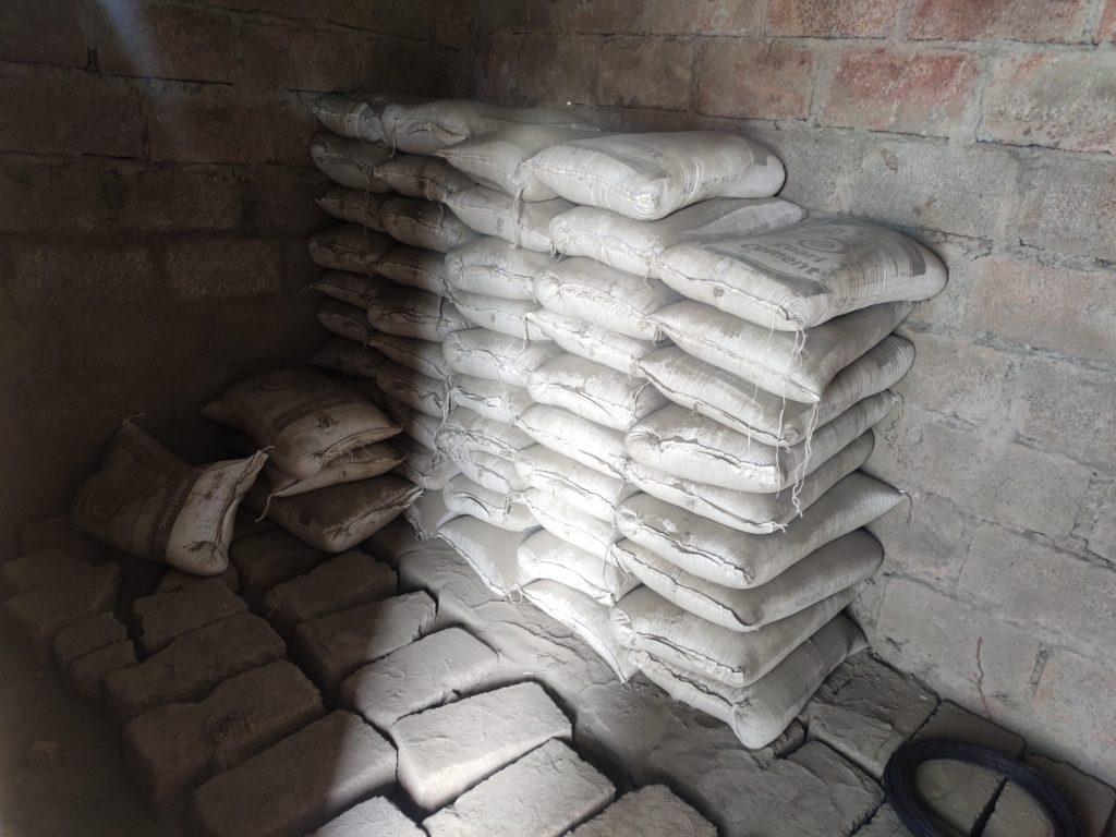 Cement bags are placed in a single row which helps in counting